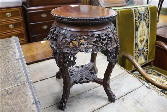 A pair of 19th century Chinese carved hardwood jardiniere stands